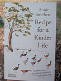 Book cover of 'Recipe for a Kinder Life' by Annie Smithers with illustrations of a tree and birds.