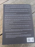 Back cover of sourdough without fail book with text and a barcode on a wooden surface