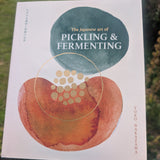 Book titled 'The Japanese Art of Pickling & Fermenting' held in front of a natural background