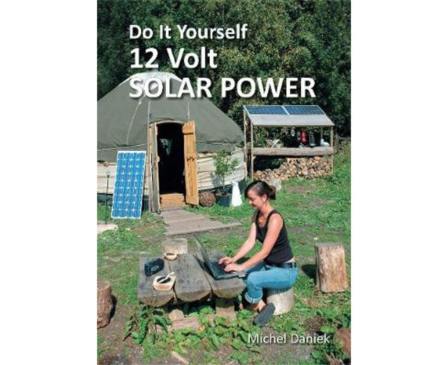 Book cover of 'Do It Yourself 12 Volt Solar Power' with a person using a laptop outdoors.